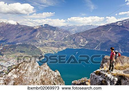 "Climber on the Cima Rocca, via ferrata with view of Lake Garda, Riva and Nago-Torbole, Trentino, Italy, Europe" View Large Photo Image Stock Image - "Climber on the Cima Rocca, via ferrata with view of Lake Garda, Riva and Nago-Torbole, Trentino, Italy, Europe". Fotosearch