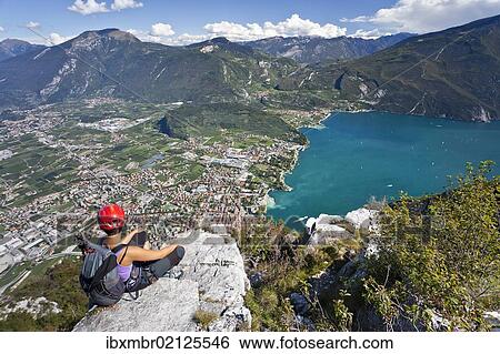 "Climber on the Via dell Amicizia climbing route, overlooking Lake Garda and Riva, Trento, Italy, Europe" View Large Photo Image Stock Photograph - "Climber on the Via dell Amicizia climbing route, overlooking Lake Garda and Riva, Trento, Italy, Europe". Fotosearch