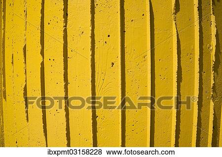 Stock Photo - Close-up of a yellow concrete wall. Fotosearch