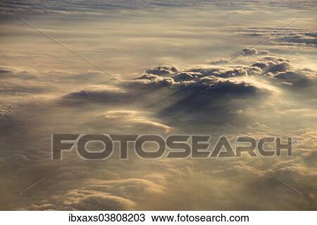 Stock Image - "Cloud formations in the evening light, Germany, Europe". Fotosearch
