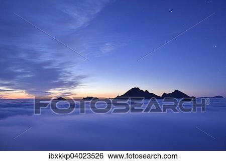 "Clouds and mountain peaks, view from Offersoykammen at dusk, Lofoten, Norway, Europe" View Large Photo Image Stock Photograph - "Clouds and mountain peaks, view from Offersoykammen at dusk, Lofoten, Norway, Europe". Fotosearch