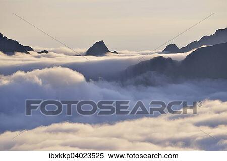 Stock Photography - "Clouds and mountain peaks, view from Offersoykammen, Lofoten, Norway, Europe". Fotosearch
