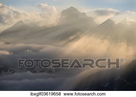 "Clouds at the Furka Pass with mountains Finstaarhorn, Jungfrau and Moench, Oberwald, Canton of Valais, Switzerland, Europe" View Large Photo Image Stock Photo - "Clouds at the Furka Pass with mountains Finstaarhorn, Jungfrau and Moench, Oberwald, Canton of Valais, Switzerland, Europe". Fotosearch