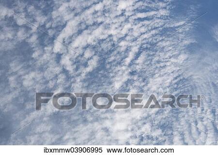 Clouds in the blue sky View Large Photo Image Stock Photography - Clouds in the blue sky. Fotosearch