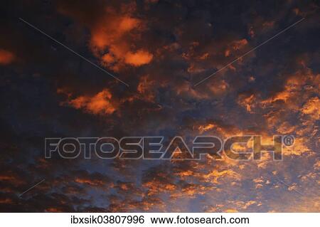 Stock Photograph - "Clouds in the sky at dawn, Germany, Europe". Fotosearch