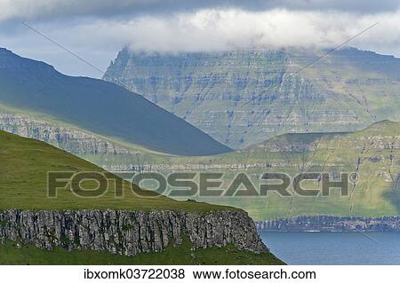 Stock Photo - "Clouds over the islands of Kalsoy and Kunoy, Eysturoy, Faroe Islands, Denmark, Europe". Fotosearch