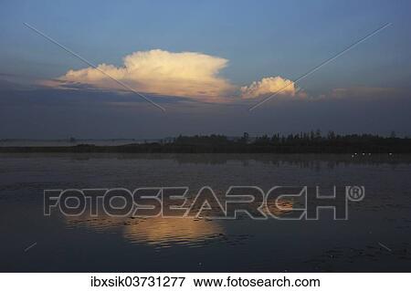 "Cloudy atmosphere, lake, reflection, Federsee lake, near Bad Buchau, Baden-Wurttemberg, Germany, Europe" View Large Photo Image Stock Photo - "Cloudy atmosphere, lake, reflection, Federsee lake, near Bad Buchau, Baden-Wurttemberg, Germany, Europe". Fotosearch