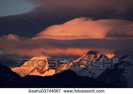 Stock Photo - "Cloudy mood over the snowy, Pennine Alps, Riederfurka, Canton of Valais, Switzerland, Europe". Fotosearch