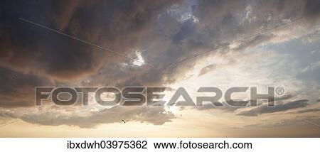 Stock Image - "Cloudy sky, Mecklenburg-Western Pomerania, Germany, Europe". Fotosearch
