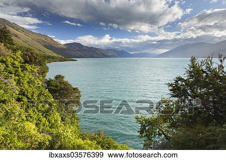 Stock Photo - "Cloudy sky over Lake Wanaka, Makarora, Otago Region, New Zealand, Oceania". Fotosearch