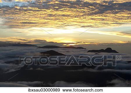 "Cloudy sky, sunrise over the mountains, view from Adam's Peak, Sri Pada, Zentrales Hochland, Dalhousie, Sri Lanka, Asia" View Large Photo Image Stock Photo - "Cloudy sky, sunrise over the mountains, view from Adam's Peak, Sri Pada, Zentrales Hochland, Dalhousie, Sri Lanka, Asia". Fotosearch