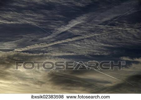 Cloudy sky with chemtrails View Large Photo Image Stock Photo - Cloudy sky with chemtrails. Fotosearch