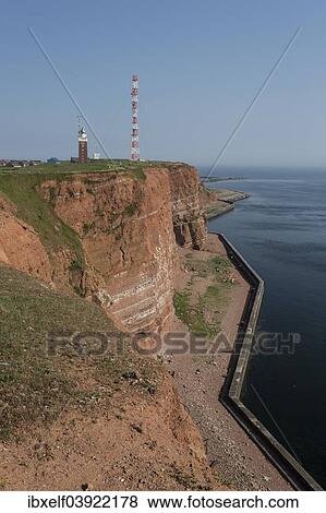 Stock Photo - "Coast with lighthouse, Heligoland, Schleswig-Holstein, Germany, Europe". Fotosearch