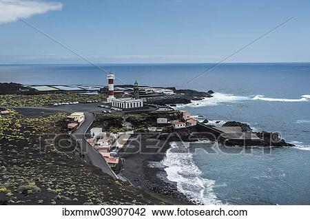 Stock Image - "Coast with the Salinas Teneguia salt evaporation ponds, old and new lighthouse, on the southern cape of Punta de Fuencaliente, La Palma, Canary Islands, Spain, Europe". Fotosearch