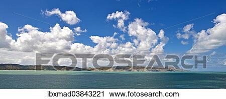 "Coastal landscape with cumulus clouds, near Mahia, Mahia Peninsula, Hawkes Bay Region, North Island, New Zealand, Oceania" View Large Photo Image Stock Image - "Coastal landscape with cumulus clouds, near Mahia, Mahia Peninsula, Hawkes Bay Region, North Island, New Zealand, Oceania". Fotosearch