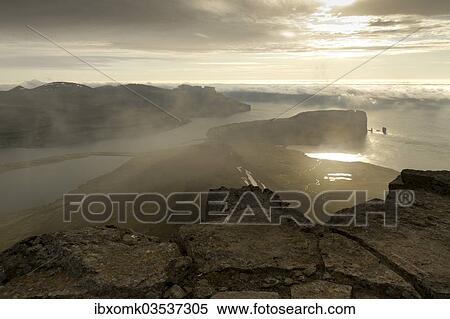 "Coastal landscape with Kollur Mountain and the sea stacks of Risin and Kellingin in the evening light, Eioi, Eysturoy, Faroe Islands, Denmark, Europe" View Large Photo Image Stock Photography - "Coastal landscape with Kollur Mountain and the sea stacks of Risin and Kellingin in the evening light, Eioi, Eysturoy, Faroe Islands, Denmark, Europe". Fotosearch