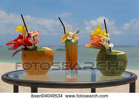 "Cocktails served in coconuts, Mauritius, Africa" View Large Photo Image Picture - "Cocktails served in coconuts, Mauritius, Africa". Fotosearch