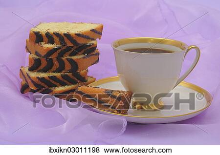 "Coffee cup with a gold rim, slices of ring cake" View Large Photo Image Stock Photo - "Coffee cup with a gold rim, slices of ring cake". Fotosearch