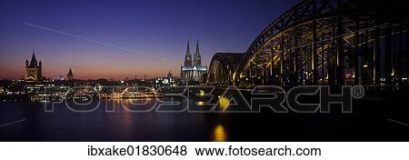 Stock Photo - "Cologne panorama, Great St. Martin Church, Cologne Cathedral and Hohenzollern Bridge, blue hour, dusk, Cologne, North Rhine-Westphalia, Germany, Europe". Fotosearch