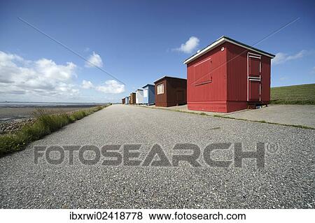 "Colorful beach huts on the dike at the North Sea, Dagebuell, North Frisia, Schleswig-Holstein, Germany, Europe" View Large Photo Image Stock Photo - "Colorful beach huts on the dike at the North Sea, Dagebuell, North Frisia, Schleswig-Holstein, Germany, Europe". Fotosearch