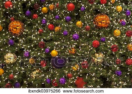 "Colourful Christmas baubles and fairy lights, Christmas tree" View Large Photo Image Stock Photograph - "Colourful Christmas baubles and fairy lights, Christmas tree". Fotosearch