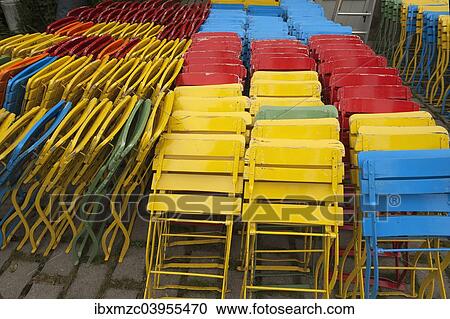 "Colourful, folded folding chairs, Bavaria, Germany, Europe" View Large Photo Image Stock Image - "Colourful, folded folding chairs, Bavaria, Germany, Europe". Fotosearch