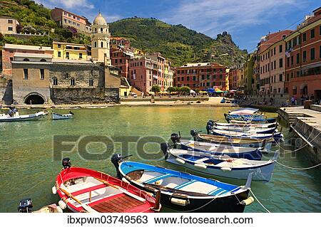 Stock Image - "Colourful houses and boats in the fishing port of Vernazza in the morning light, UNESCO World Heritage Site, Cinque Terre National Park, Vernazza, Liguria, Italy, Europe". Fotosearch