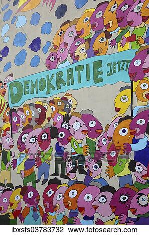 "Colourful mural with the words """"Demokratie jetzt"""", German for """"Democracy now"""" on a wall of the Marriott Hotel Leipzig, Leipzig, Saxony, Germany, Europe" View Large Photo Image Stock Image - "Colourful mural with the words """"Demokratie jetzt"""", German for """"Democracy now"""" on a wall of the Marriott Hotel Leipzig, Leipzig, Saxony, Germany, Europe". Fotosearch