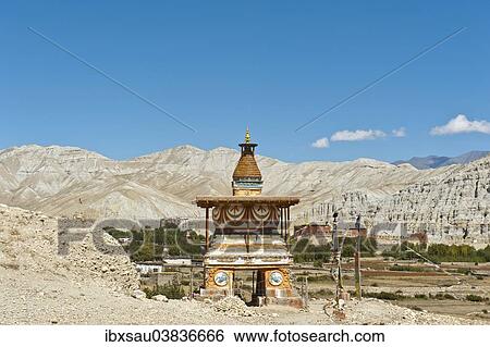 "Colourfully decorated Buddhist stupa at the entrance to the village, gate chorten, Dzong fortress and the Thubten Shedrup Dargyeling Monastery at the back, Charang, Tsarang, Upper Mustang, Lo, Himalayas, Nepal, Asia" View Large Photo Image Stock Photograph - "Colourfully decorated Buddhist stupa at the entrance to the village, gate chorten, Dzong fortress and the Thubten Shedrup Dargyeling Monastery at the back, Charang, Tsarang, Upper Mustang, Lo, Himalayas, Nepal, Asia". Fotosearch