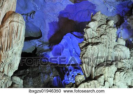 Stock Image - "Colourfully, illuminated rock formation in Hang Sung Sot cave, Surprise Cave, Cave of Awe, a UNESCO World Heritage Site, stalactite cave in Halong Bay, Vietnam, Southeast Asia, Asia". Fotosearch