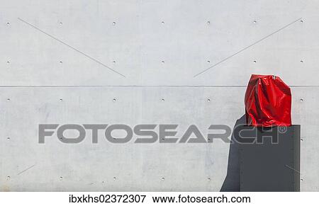 "Column with a red hood against a bare cement wall, Berlin, Germany, Europe" View Large Photo Image Stock Photo - "Column with a red hood against a bare cement wall, Berlin, Germany, Europe". Fotosearch