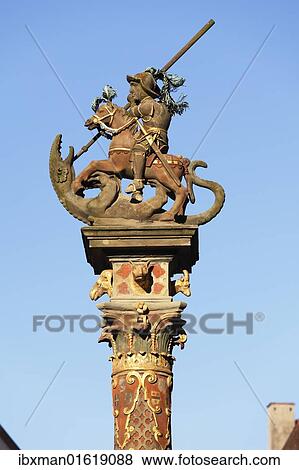 Stock Photo - "Column with equestrian monument of St. George on the market square, Rothenburg ob der Tauber, Romantic Road, Middle Franconia, Franconia, Bavaria, Germany, Europe". Fotosearch