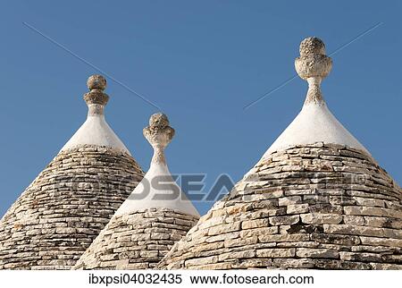 Stock Photography - "Conical roofs and pinnacles of Trullo houses, Trulli District, Alberobello, Apulia, Italy, Europe". Fotosearch