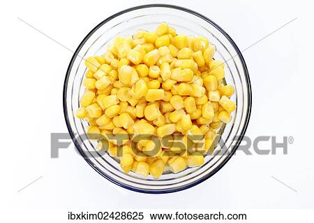 Stock Photography - Corn out of the can in a glass bowl. Fotosearch