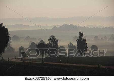 "Country road, Upper Swabian countryside, morning fog, morning mood, near Offingen, Upper Swabia, Baden-Wurttemberg, Germany, Europe" View Large Photo Image Stock Photograph - "Country road, Upper Swabian countryside, morning fog, morning mood, near Offingen, Upper Swabia, Baden-Wurttemberg, Germany, Europe". Fotosearch