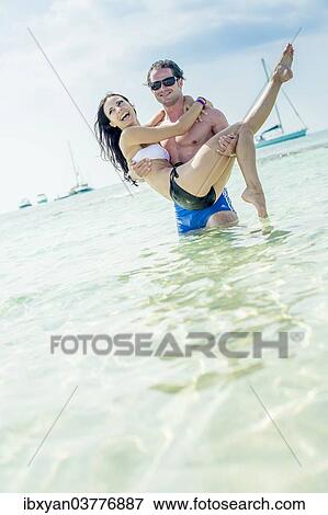 Stock Photo - "Couple in the sea, Ibiza, Spain, Europe". Fotosearch