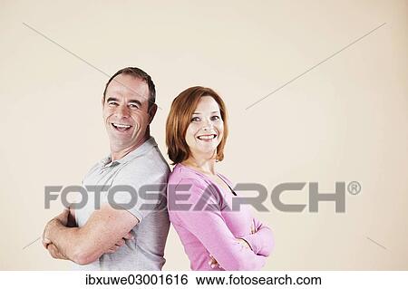"Couple smiling, shoulders back to back, Mannheim, Baden-Wurttemberg, Germany, Europe" View Large Photo Image Stock Photograph - "Couple smiling, shoulders back to back, Mannheim, Baden-Wurttemberg, Germany, Europe". Fotosearch