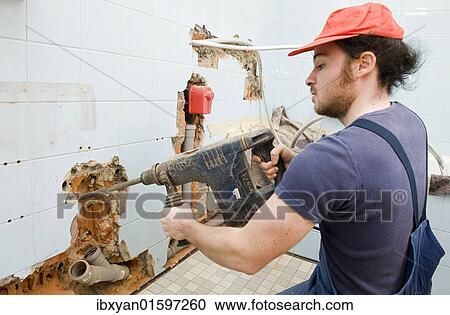 Craftsman working with a drill View Large Photo Image Stock Image - Craftsman working with a drill. Fotosearch