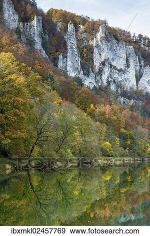 "Craggy limestone cliffs with a deciduous forest with autumnal colours in the Danube Valley, Baden-Wuerttemberg, Germany, Europe" View Large Photo Image Stock Photo - "Craggy limestone cliffs with a deciduous forest with autumnal colours in the Danube Valley, Baden-Wuerttemberg, Germany, Europe". Fotosearch