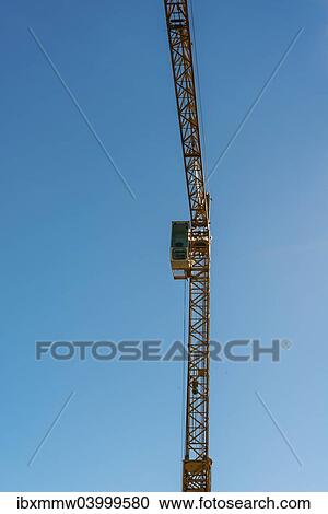 Stock Image - Crane against blue sky. Fotosearch