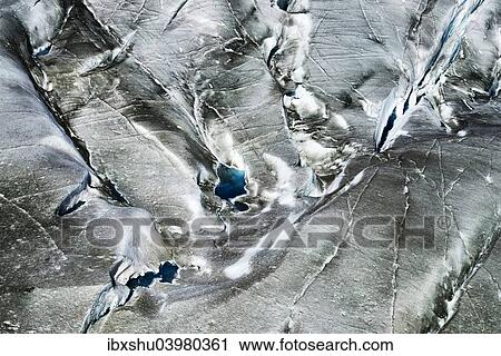 "Crevasses with small glacial lakes, Great Aletsch Glacier, Canton of Valais, Goms, Switzerland, Europe" View Large Photo Image Stock Image - "Crevasses with small glacial lakes, Great Aletsch Glacier, Canton of Valais, Goms, Switzerland, Europe". Fotosearch