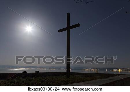 Picture - "Cross at the Concentration Camp Memorial Site in the full moon light, Meersburg, Baden-Wurttemberg, Germany, Europe". Fotosearch