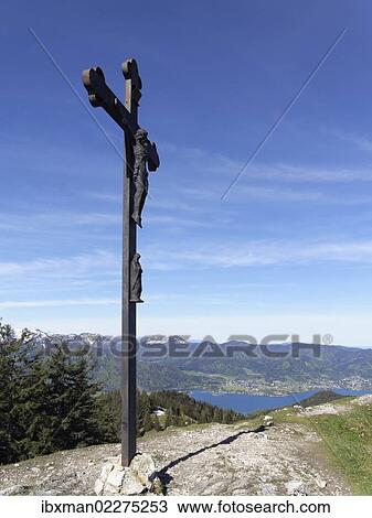 "Cross on the summit of Baumgartenschneid mountain, lake Tegernsee and Bad Wiessee, Tegernsee valley, Mangfall Mountains, Upper Bavaria, Bavaria, Germany, Europe" View Large Photo Image Stock Image - "Cross on the summit of Baumgartenschneid mountain, lake Tegernsee and Bad Wiessee, Tegernsee valley, Mangfall Mountains, Upper Bavaria, Bavaria, Germany, Europe". Fotosearch