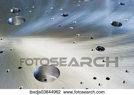 Cut metal surface with drilled holes View Large Photo Image Stock Image - Cut metal surface with drilled holes. Fotosearch