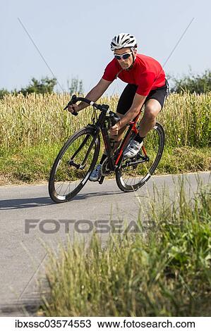 "Cyclist, 44 years, riding a racing cycle, Winterbach, Baden-Wurttemberg, Germany, Europe" View Large Photo Image Stock Image - "Cyclist, 44 years, riding a racing cycle, Winterbach, Baden-Wurttemberg, Germany, Europe". Fotosearch