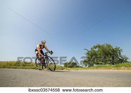 "Cyclist, 44 years, riding a racing cycle, Winterbach, Baden-Wurttemberg, Germany, Europe" View Large Photo Image Stock Photo - "Cyclist, 44 years, riding a racing cycle, Winterbach, Baden-Wurttemberg, Germany, Europe". Fotosearch