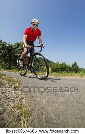 "Cyclist, 44 years, riding a racing cycle, Winterbach, Baden-Wurttemberg, Germany, Europe" View Large Photo Image Stock Photography - "Cyclist, 44 years, riding a racing cycle, Winterbach, Baden-Wurttemberg, Germany, Europe". Fotosearch