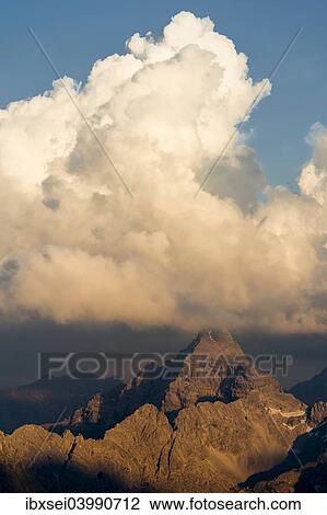 Stock Image - "Dark clouds above the Allgau Alps, Oberstdorf, Bavaria, Germany, Europe". Fotosearch