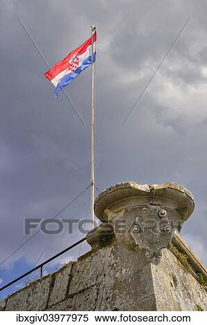 "Dark clouds over the Croatian flag on the Venetian Castle, Pula, Istria, Croatia, Europe" View Large Photo Image Stock Photography - "Dark clouds over the Croatian flag on the Venetian Castle, Pula, Istria, Croatia, Europe". Fotosearch