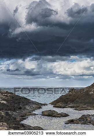 "Dark clouds, rocks by the sea, La Palma, Canary Islands, Spain, Europe" View Large Photo Image Stock Image - "Dark clouds, rocks by the sea, La Palma, Canary Islands, Spain, Europe". Fotosearch
